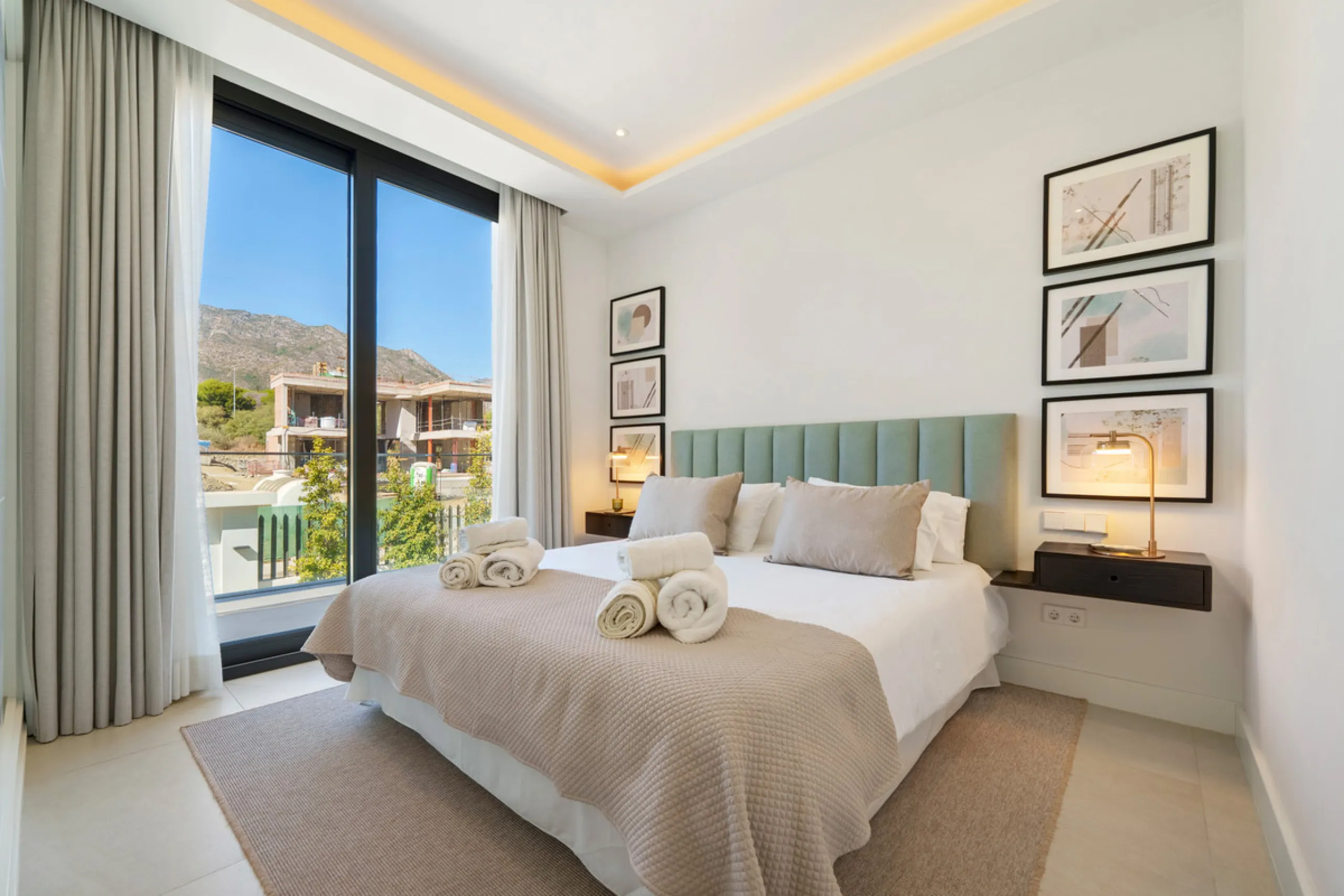 Nestled in the prestigious Altos de Puente Romano on Marbella's Golden Mile, Villa Romano is the epitome of modern Mediterranean luxury. This striking six-bedroom, six-bathroom residence blends sleek contemporary architecture with warm natural tones, crea
