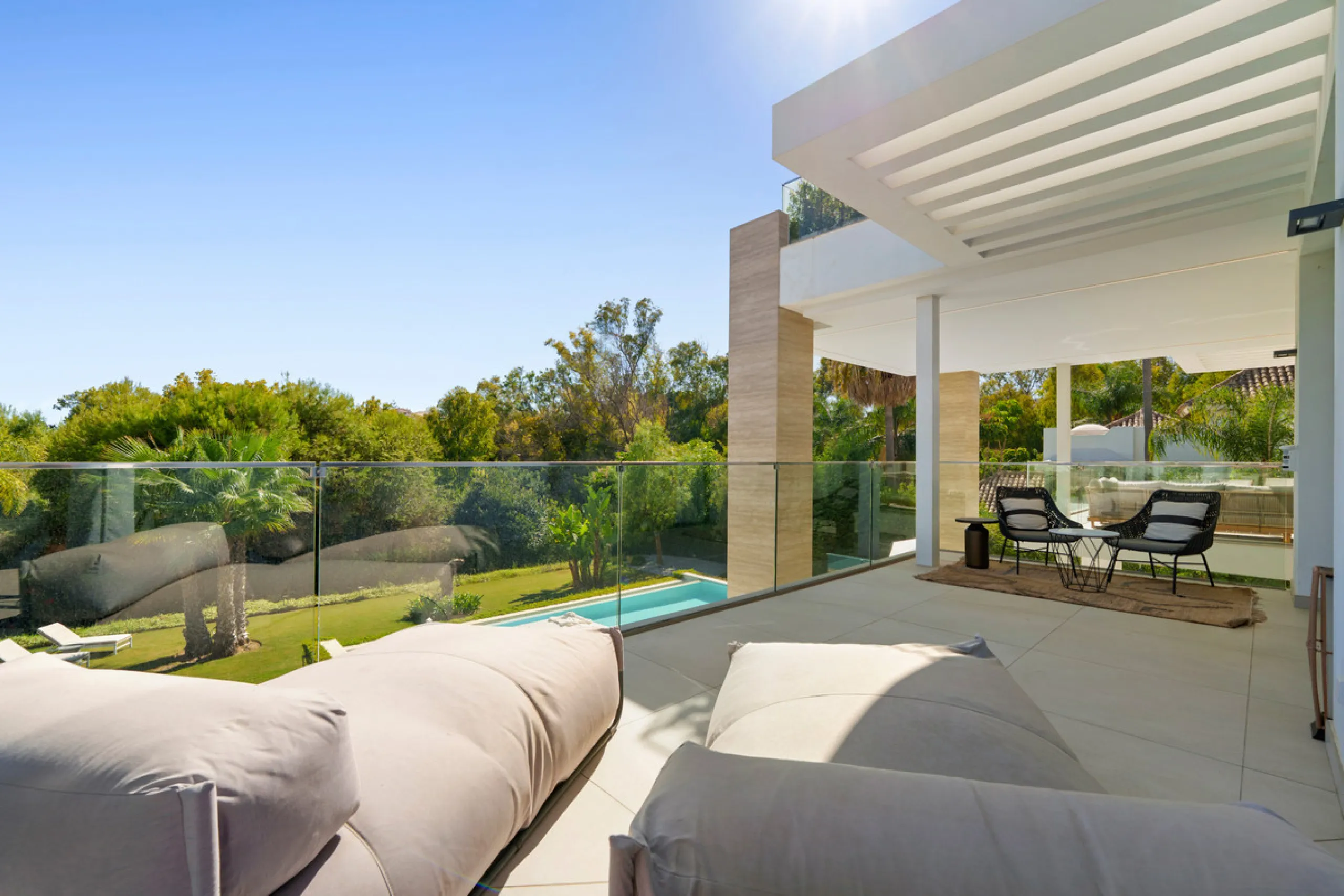 Nestled in the prestigious Altos de Puente Romano on Marbella's Golden Mile, Villa Romano is the epitome of modern Mediterranean luxury. This striking six-bedroom, six-bathroom residence blends sleek contemporary architecture with warm natural tones, crea