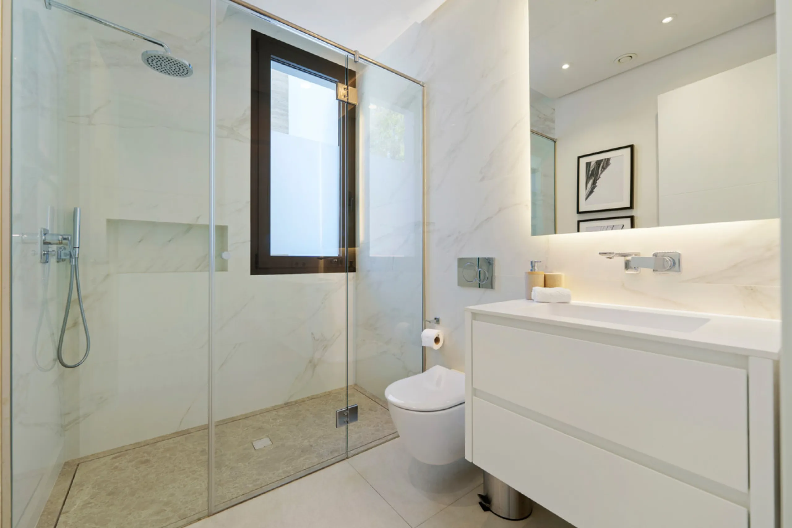 Nestled in the prestigious Altos de Puente Romano on Marbella's Golden Mile, Villa Romano is the epitome of modern Mediterranean luxury. This striking six-bedroom, six-bathroom residence blends sleek contemporary architecture with warm natural tones, crea