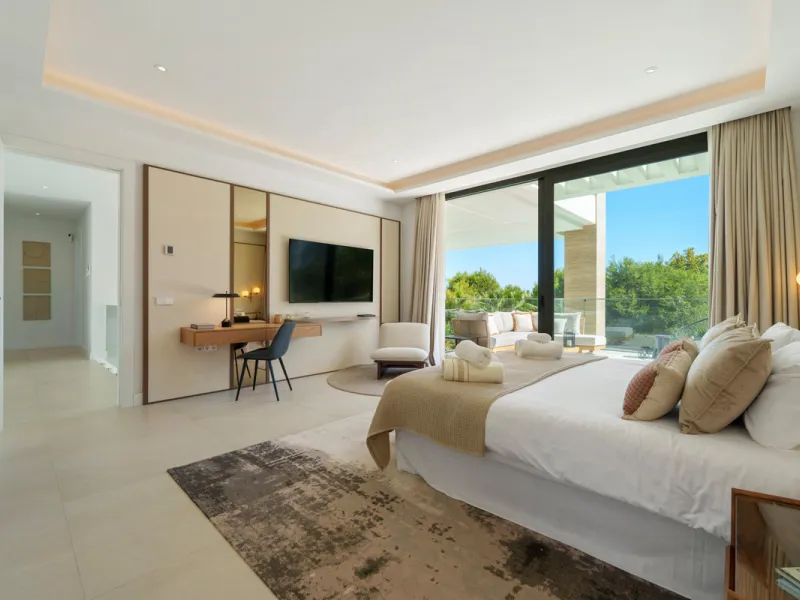 Nestled in the prestigious Altos de Puente Romano on Marbella's Golden Mile, Villa Romano is the epitome of modern Mediterranean luxury. This striking six-bedroom, six-bathroom residence blends sleek contemporary architecture with warm natural tones, crea