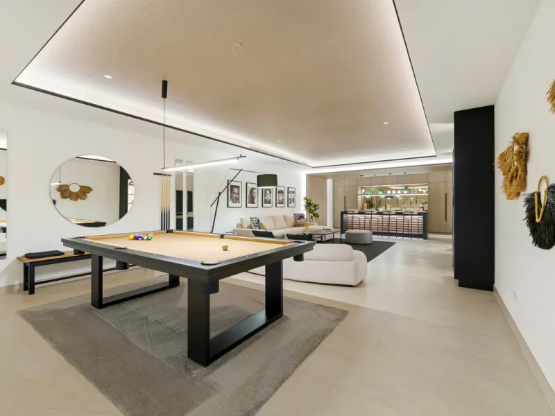 Nestled in the prestigious Altos de Puente Romano on Marbella's Golden Mile, Villa Romano is the epitome of modern Mediterranean luxury. This striking six-bedroom, six-bathroom residence blends sleek contemporary architecture with warm natural tones, crea