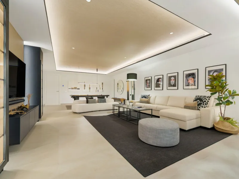 Nestled in the prestigious Altos de Puente Romano on Marbella's Golden Mile, Villa Romano is the epitome of modern Mediterranean luxury. This striking six-bedroom, six-bathroom residence blends sleek contemporary architecture with warm natural tones, crea