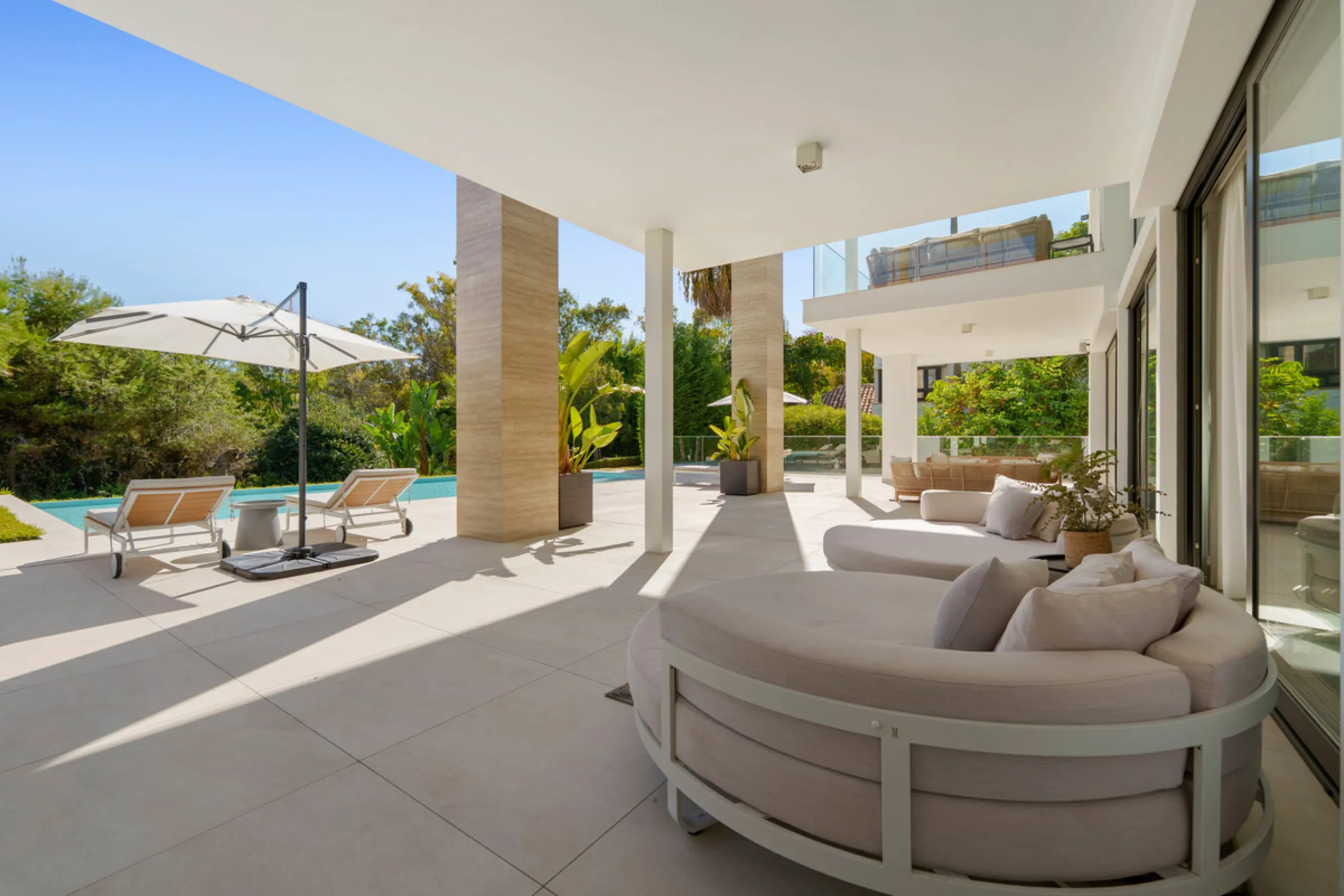 Nestled in the prestigious Altos de Puente Romano on Marbella's Golden Mile, Villa Romano is the epitome of modern Mediterranean luxury. This striking six-bedroom, six-bathroom residence blends sleek contemporary architecture with warm natural tones, crea