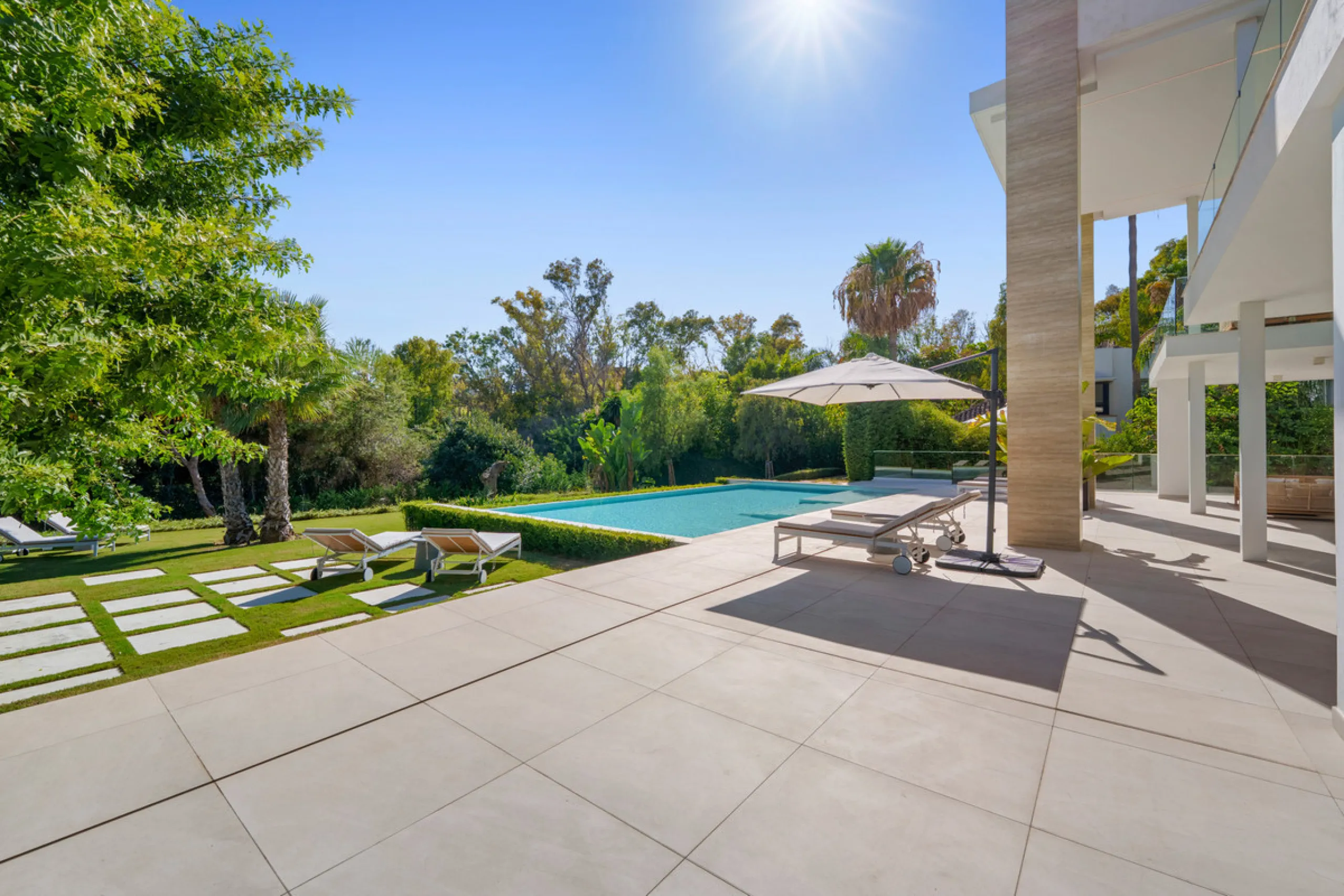 Nestled in the prestigious Altos de Puente Romano on Marbella's Golden Mile, Villa Romano is the epitome of modern Mediterranean luxury. This striking six-bedroom, six-bathroom residence blends sleek contemporary architecture with warm natural tones, crea