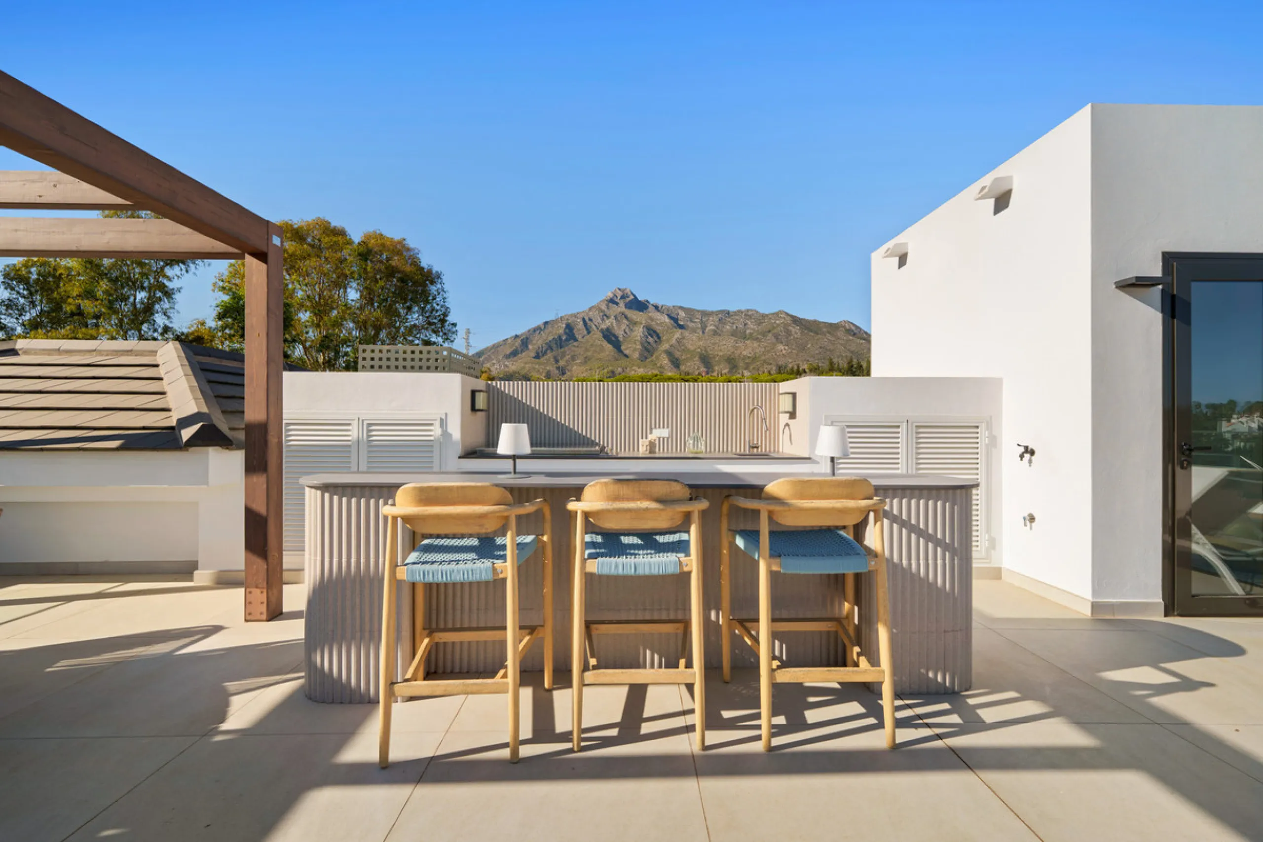 Nestled in the prestigious Altos de Puente Romano on Marbella's Golden Mile, Villa Romano is the epitome of modern Mediterranean luxury. This striking six-bedroom, six-bathroom residence blends sleek contemporary architecture with warm natural tones, crea