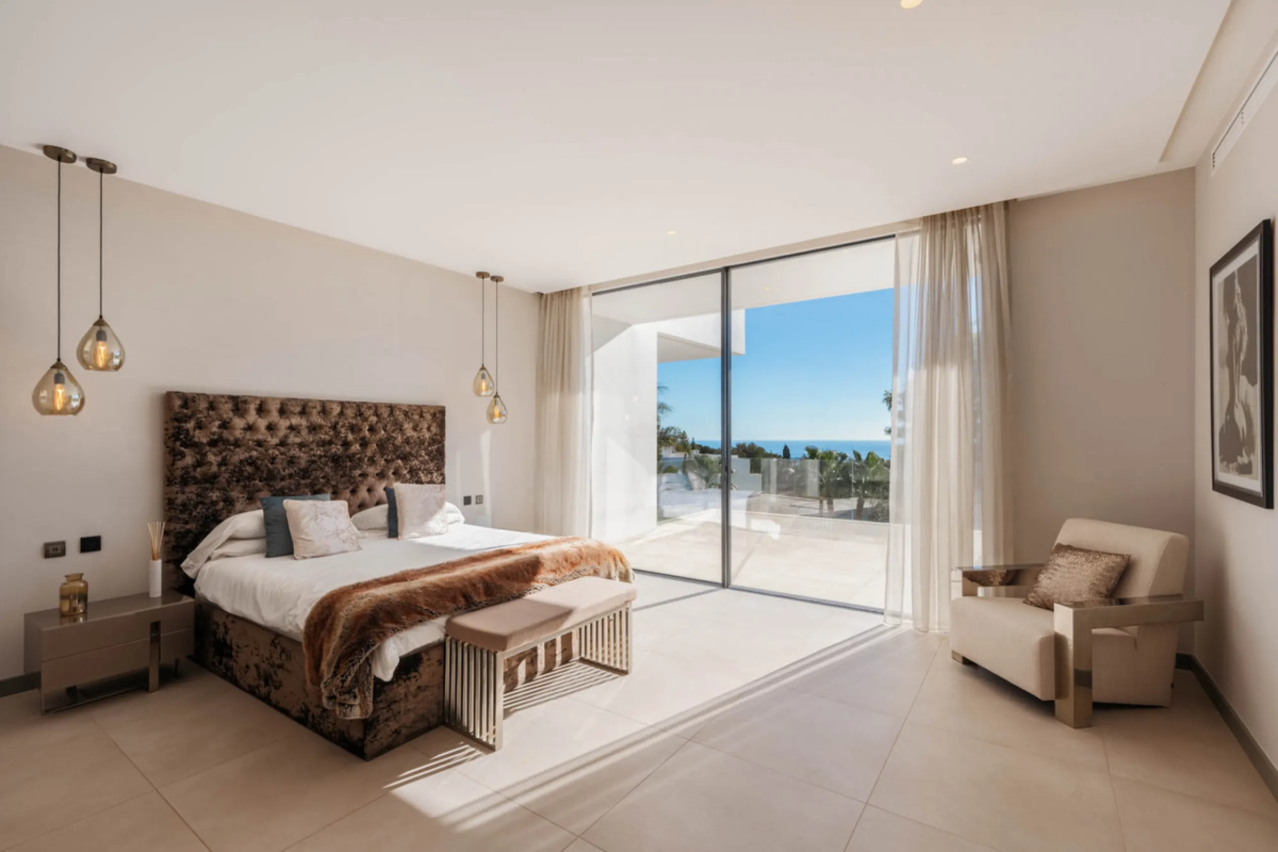 Designed by a distinguished architect, this villa is spread over two levels with an impressive built area. It features five luxurious bedrooms, each with its ensuite bathroom, an additional guest toilet, and a guest apartment that matches the main villa's