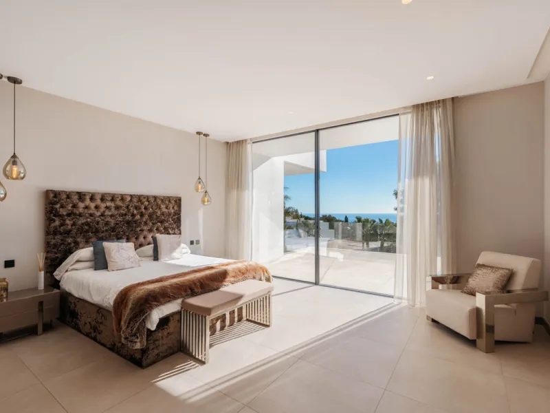 Designed by a distinguished architect, this villa is spread over two levels with an impressive built area. It features five luxurious bedrooms, each with its ensuite bathroom, an additional guest toilet, and a guest apartment that matches the main villa's