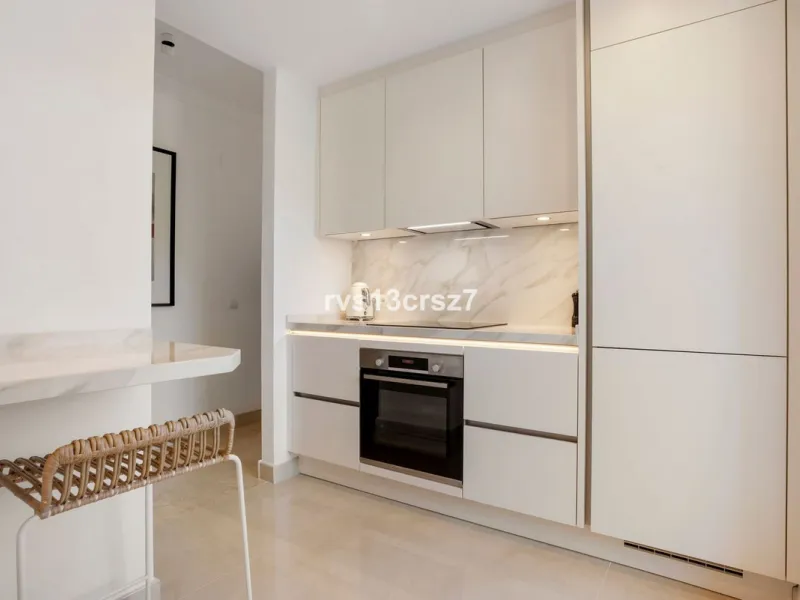 Spacious, recently renovated 3-bedroom apartment in one of the most beautiful and safest urbanizations in Elviria, "St. Maria Village." A 24-hour security community just 5 minutes from the beach, it features several swimming pools and a large, beautifully