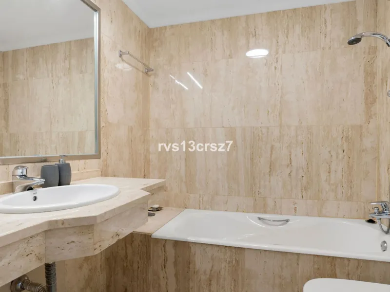 Spacious, recently renovated 3-bedroom apartment in one of the most beautiful and safest urbanizations in Elviria, "St. Maria Village." A 24-hour security community just 5 minutes from the beach, it features several swimming pools and a large, beautifully