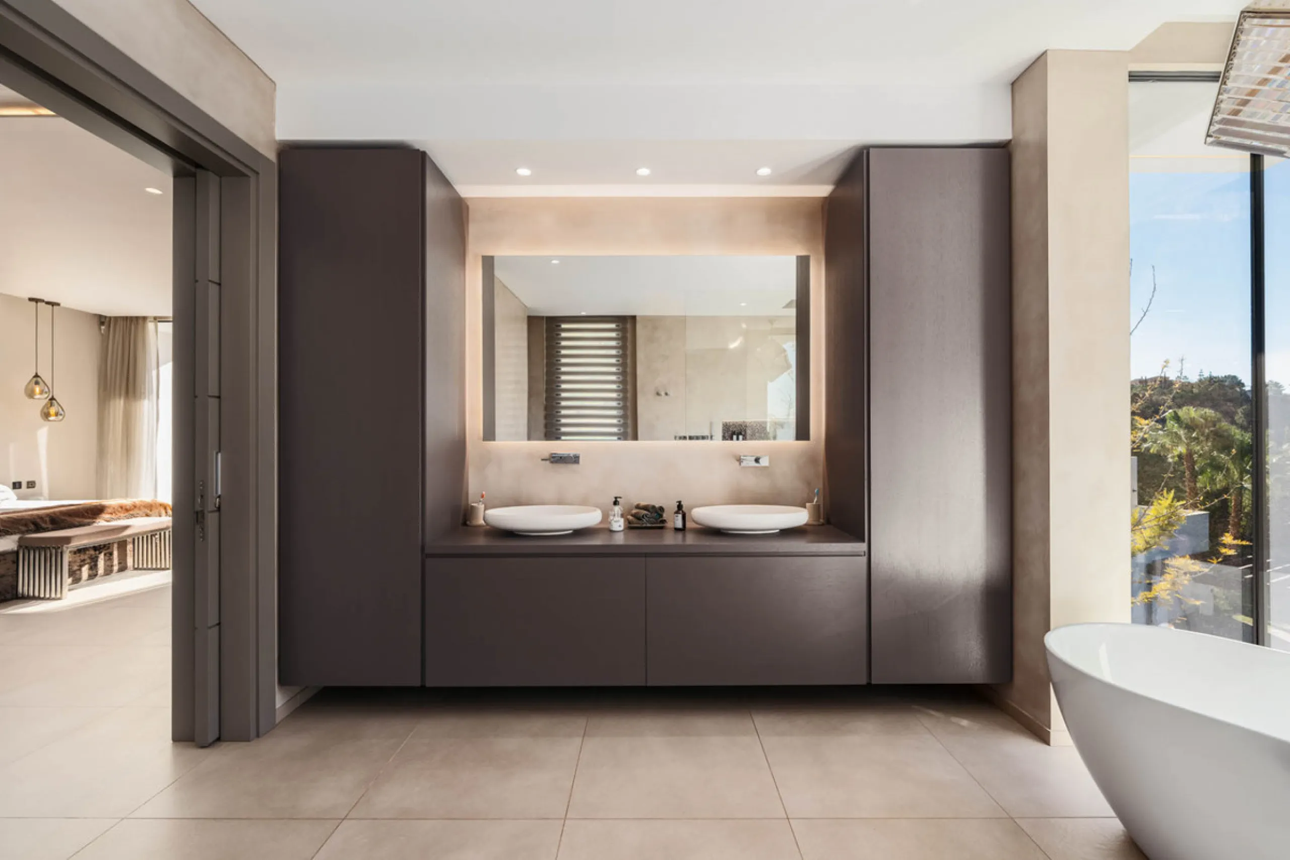 Designed by a distinguished architect, this villa is spread over two levels with an impressive built area. It features five luxurious bedrooms, each with its ensuite bathroom, an additional guest toilet, and a guest apartment that matches the main villa's