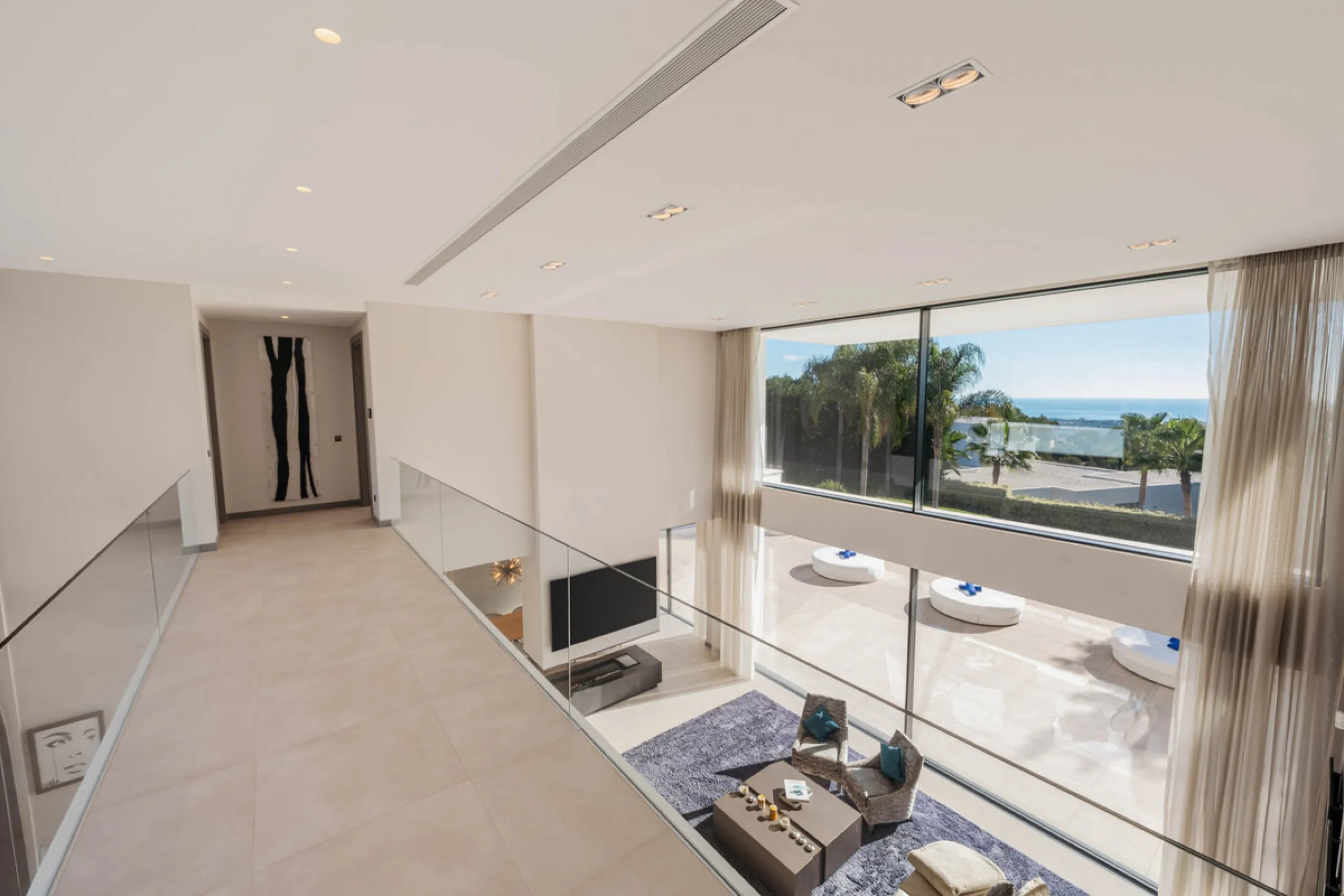 Designed by a distinguished architect, this villa is spread over two levels with an impressive built area. It features five luxurious bedrooms, each with its ensuite bathroom, an additional guest toilet, and a guest apartment that matches the main villa's