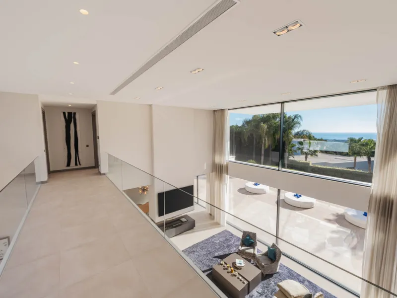 Designed by a distinguished architect, this villa is spread over two levels with an impressive built area. It features five luxurious bedrooms, each with its ensuite bathroom, an additional guest toilet, and a guest apartment that matches the main villa's