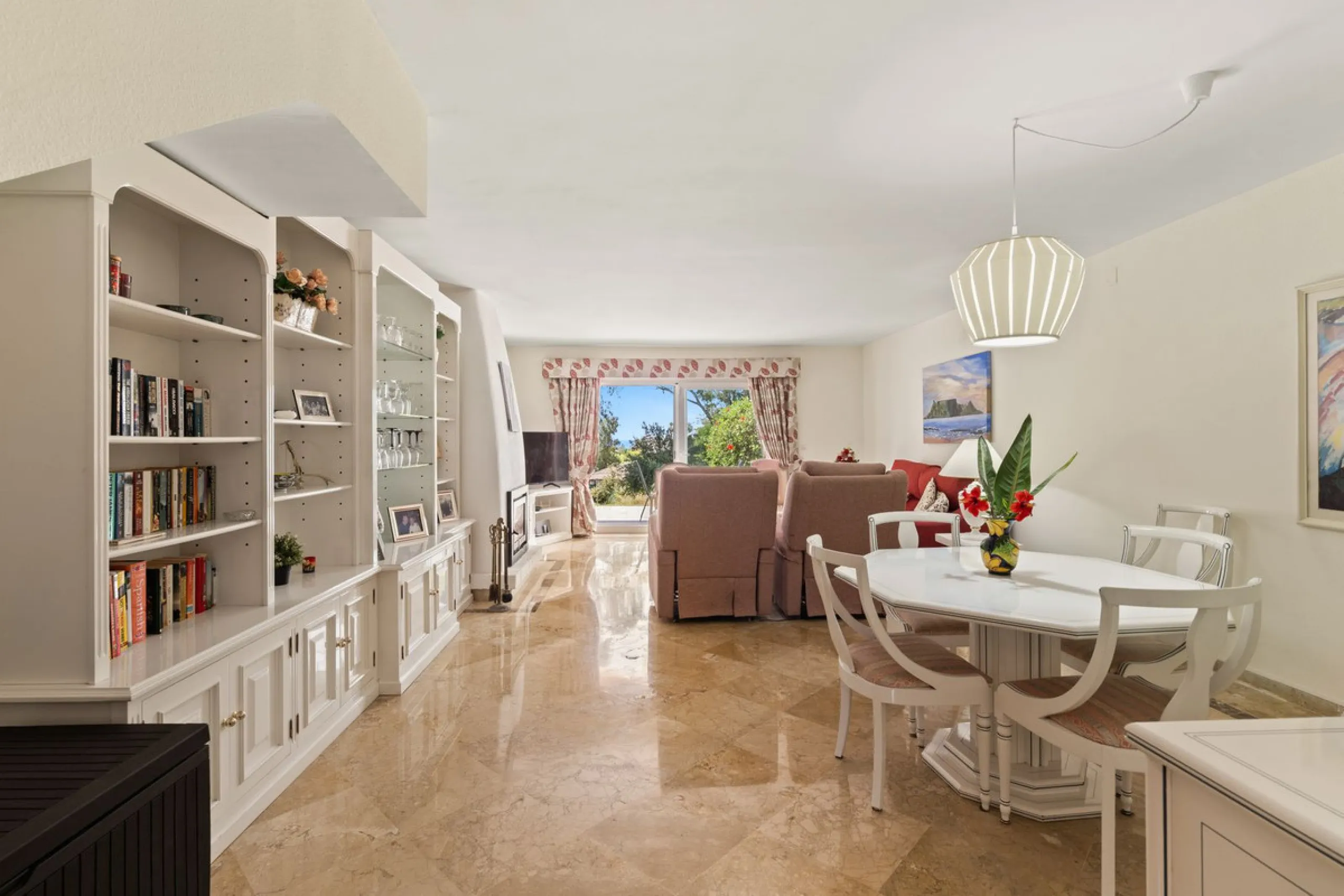 Townhouse located in a small Andalucian pueblo style community in Nueva Atalaya. The property is situated in a quiet cul de sac close to all local amenities, shopping centre, schools and golf. The community boasts a large swimming pool and park sized land