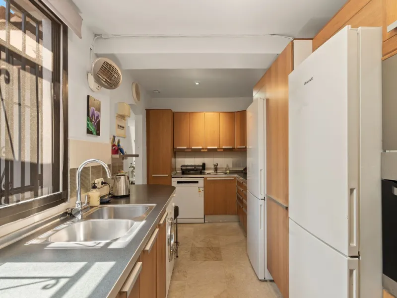 Townhouse located in a small Andalucian pueblo style community in Nueva Atalaya. The property is situated in a quiet cul de sac close to all local amenities, shopping centre, schools and golf. The community boasts a large swimming pool and park sized land