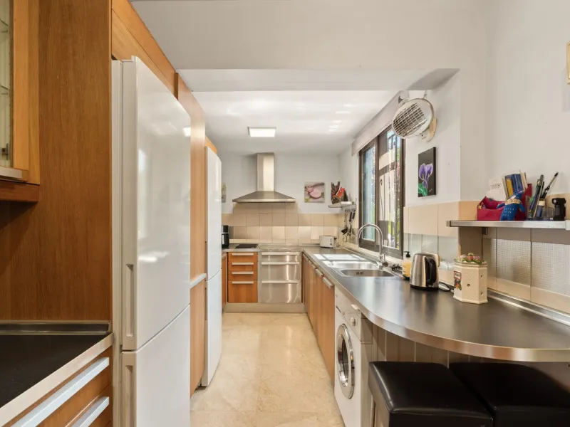 Townhouse located in a small Andalucian pueblo style community in Nueva Atalaya. The property is situated in a quiet cul de sac close to all local amenities, shopping centre, schools and golf. The community boasts a large swimming pool and park sized land