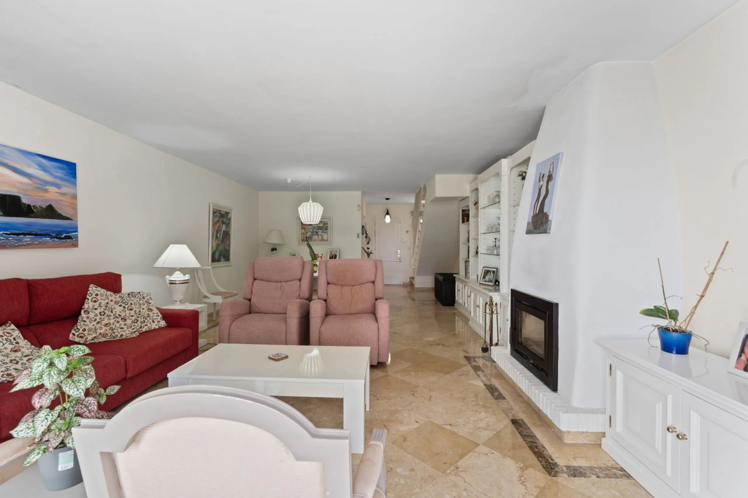 Townhouse located in a small Andalucian pueblo style community in Nueva Atalaya. The property is situated in a quiet cul de sac close to all local amenities, shopping centre, schools and golf. The community boasts a large swimming pool and park sized land