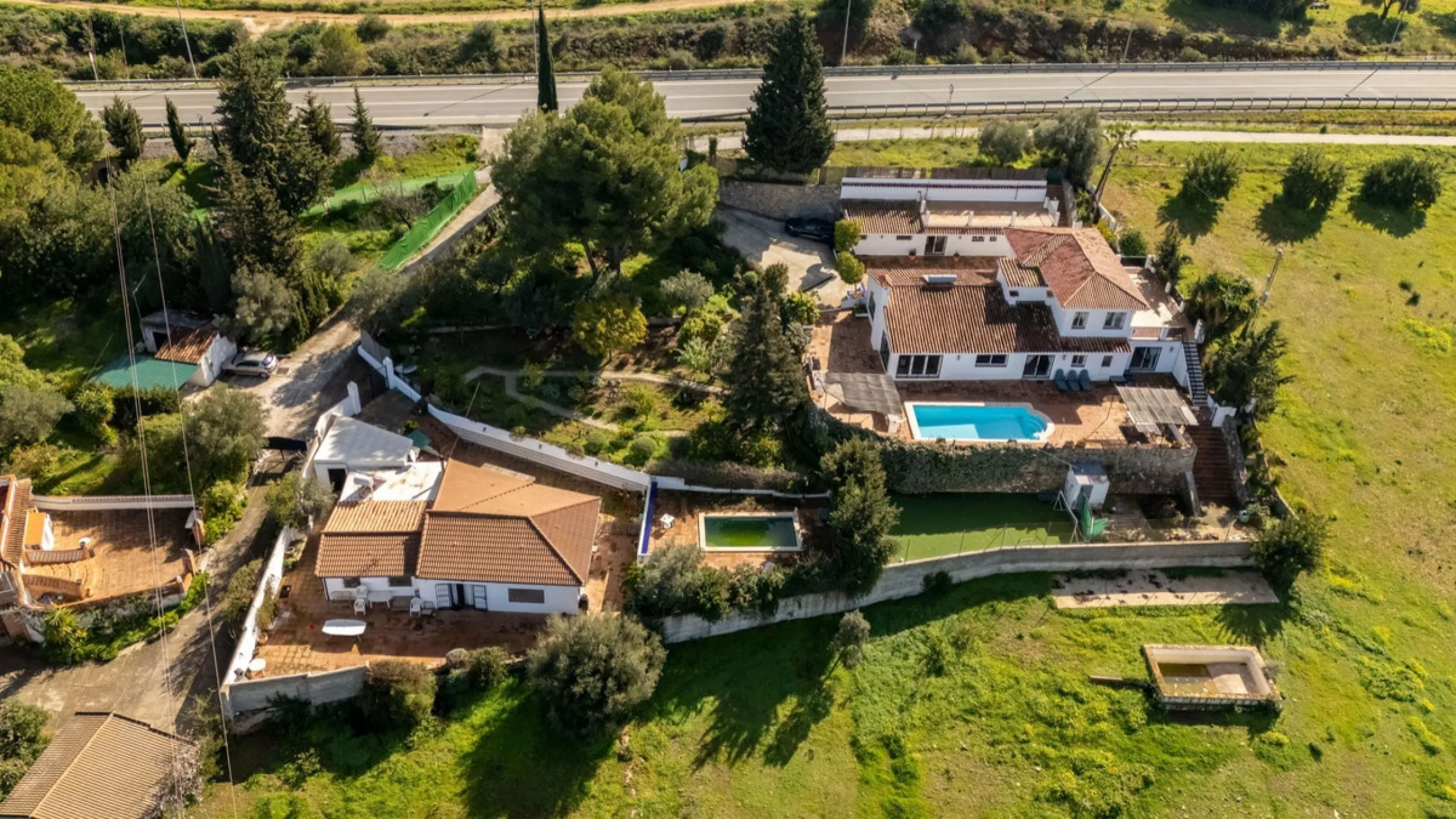 5 bedroom main house, plus a 3 bedroom guest house, a studio/apartment, garage and 2 swimming pools!