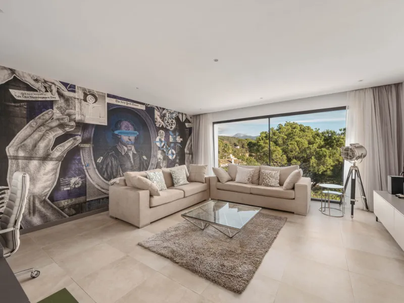 Designed by a distinguished architect, this villa is spread over two levels with an impressive built area. It features five luxurious bedrooms, each with its ensuite bathroom, an additional guest toilet, and a guest apartment that matches the main villa's