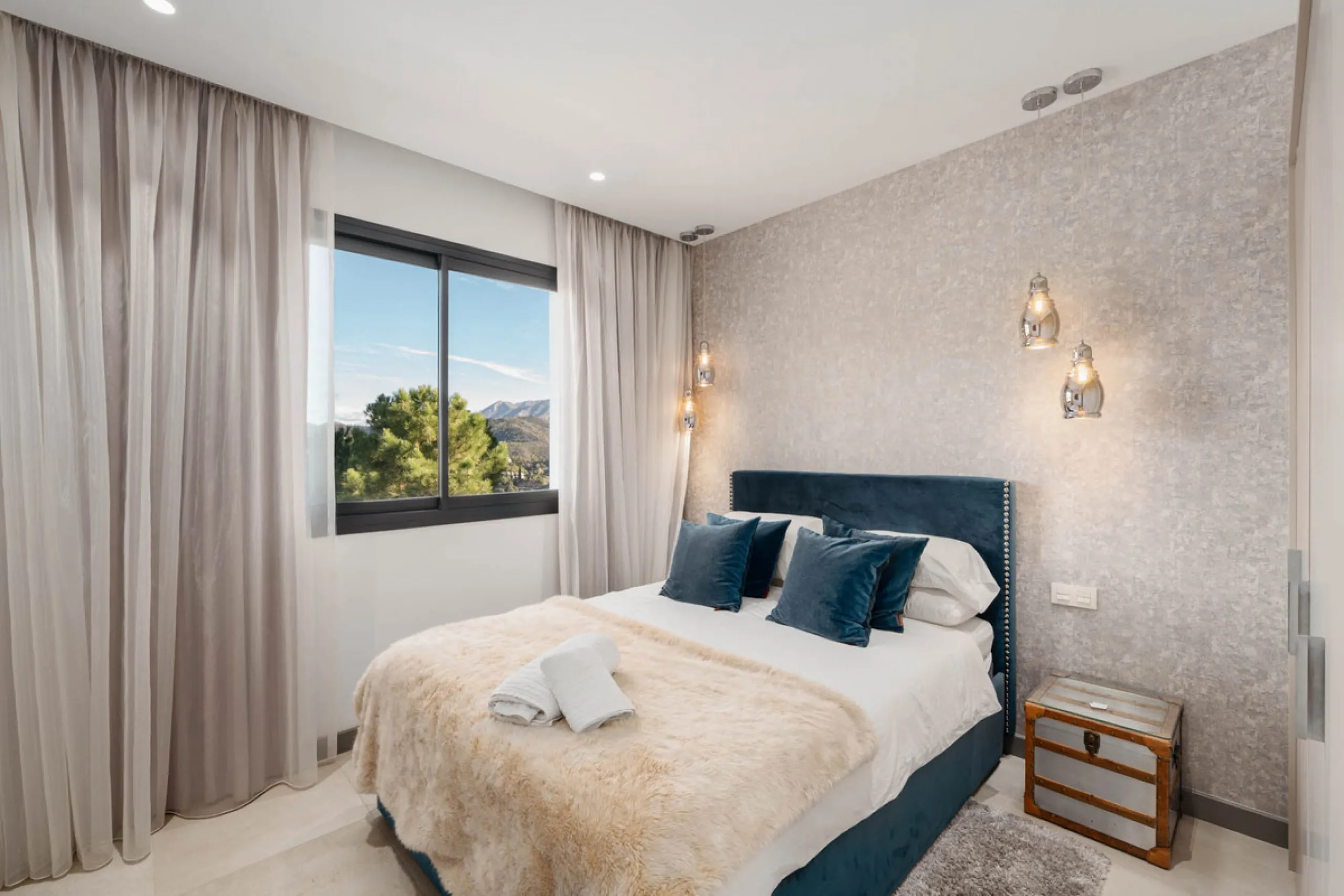 Designed by a distinguished architect, this villa is spread over two levels with an impressive built area. It features five luxurious bedrooms, each with its ensuite bathroom, an additional guest toilet, and a guest apartment that matches the main villa's