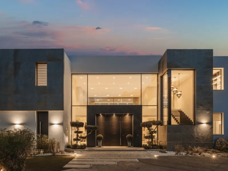 Designed by a distinguished architect, this villa is spread over two levels with an impressive built area. It features five luxurious bedrooms, each with its ensuite bathroom, an additional guest toilet, and a guest apartment that matches the main villa's