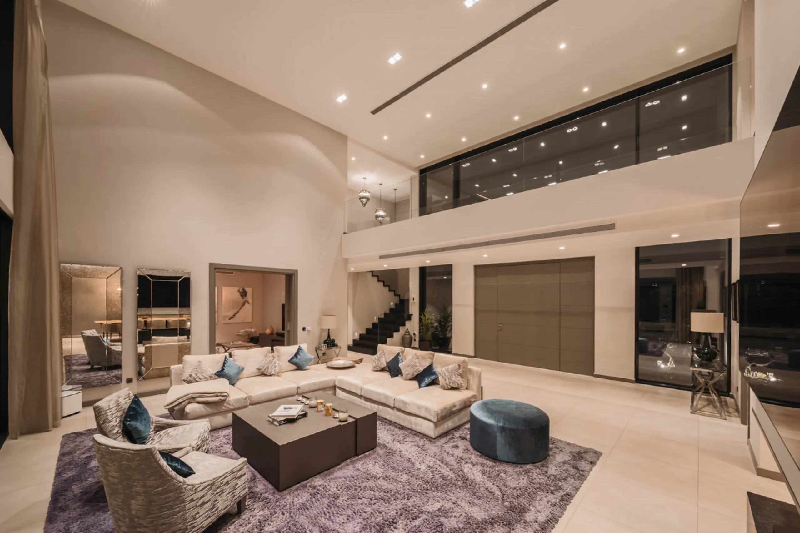 Designed by a distinguished architect, this villa is spread over two levels with an impressive built area. It features five luxurious bedrooms, each with its ensuite bathroom, an additional guest toilet, and a guest apartment that matches the main villa's