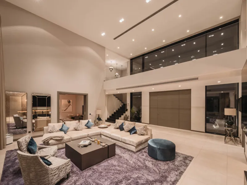 Designed by a distinguished architect, this villa is spread over two levels with an impressive built area. It features five luxurious bedrooms, each with its ensuite bathroom, an additional guest toilet, and a guest apartment that matches the main villa's