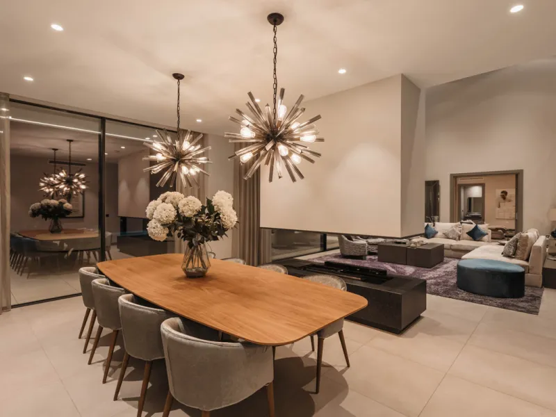 Designed by a distinguished architect, this villa is spread over two levels with an impressive built area. It features five luxurious bedrooms, each with its ensuite bathroom, an additional guest toilet, and a guest apartment that matches the main villa's