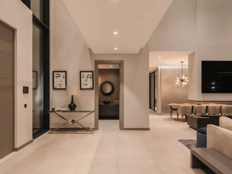 Designed by a distinguished architect, this villa is spread over two levels with an impressive built area. It features five luxurious bedrooms, each with its ensuite bathroom, an additional guest toilet, and a guest apartment that matches the main villa's