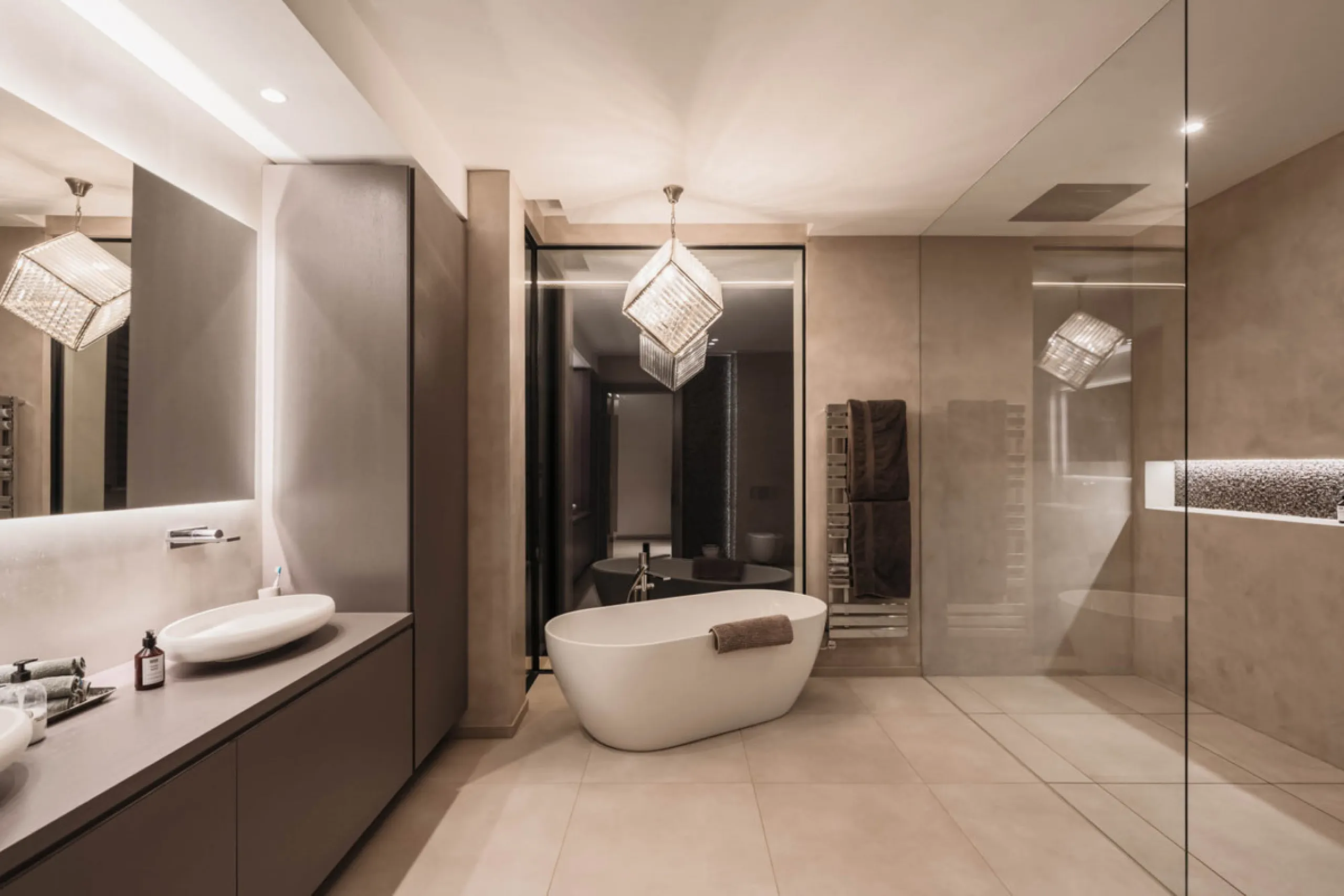 Designed by a distinguished architect, this villa is spread over two levels with an impressive built area. It features five luxurious bedrooms, each with its ensuite bathroom, an additional guest toilet, and a guest apartment that matches the main villa's