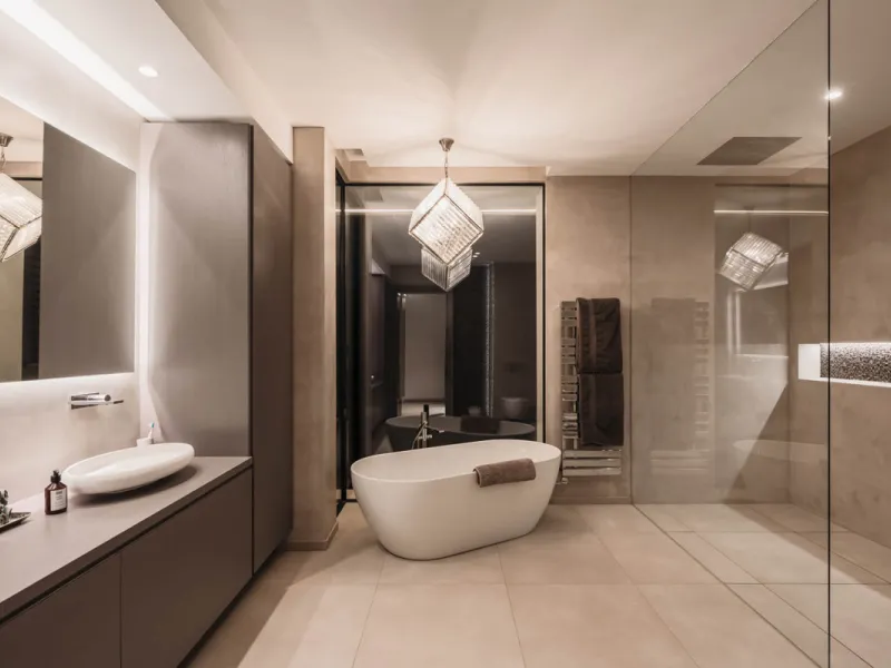 Designed by a distinguished architect, this villa is spread over two levels with an impressive built area. It features five luxurious bedrooms, each with its ensuite bathroom, an additional guest toilet, and a guest apartment that matches the main villa's
