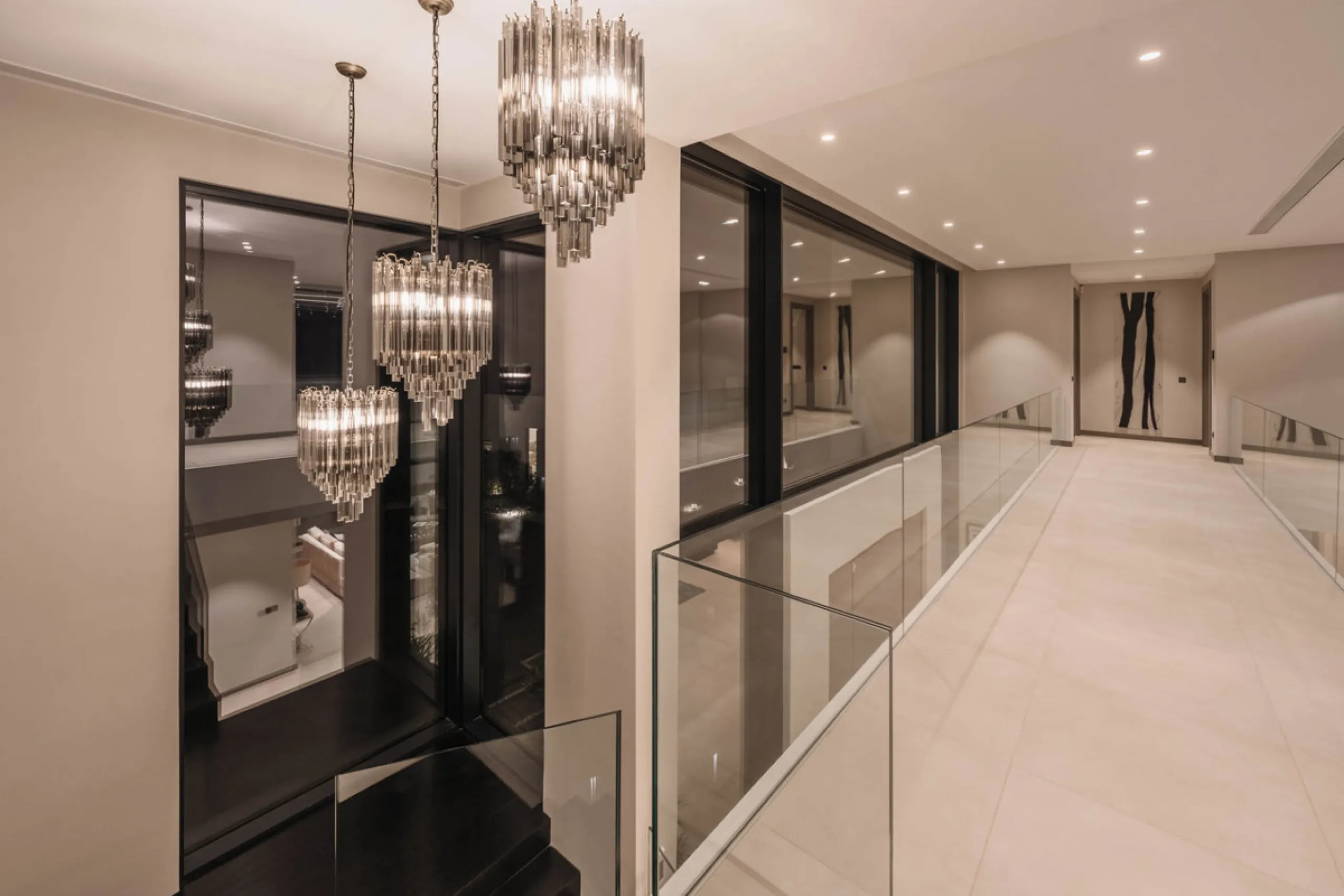 Designed by a distinguished architect, this villa is spread over two levels with an impressive built area. It features five luxurious bedrooms, each with its ensuite bathroom, an additional guest toilet, and a guest apartment that matches the main villa's