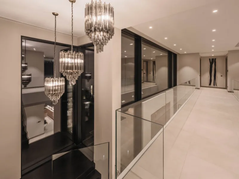 Designed by a distinguished architect, this villa is spread over two levels with an impressive built area. It features five luxurious bedrooms, each with its ensuite bathroom, an additional guest toilet, and a guest apartment that matches the main villa's