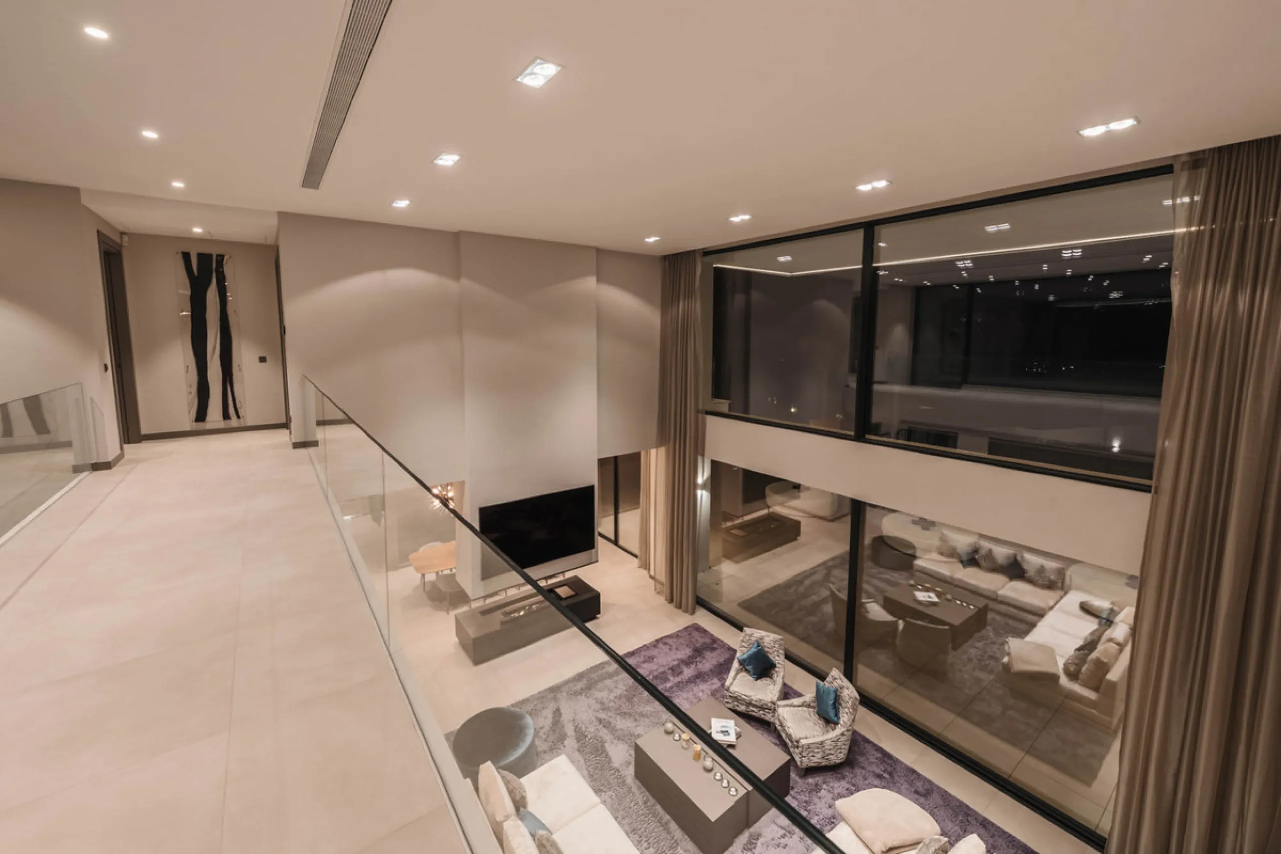 Designed by a distinguished architect, this villa is spread over two levels with an impressive built area. It features five luxurious bedrooms, each with its ensuite bathroom, an additional guest toilet, and a guest apartment that matches the main villa's