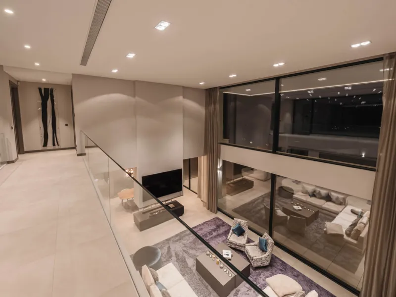 Designed by a distinguished architect, this villa is spread over two levels with an impressive built area. It features five luxurious bedrooms, each with its ensuite bathroom, an additional guest toilet, and a guest apartment that matches the main villa's
