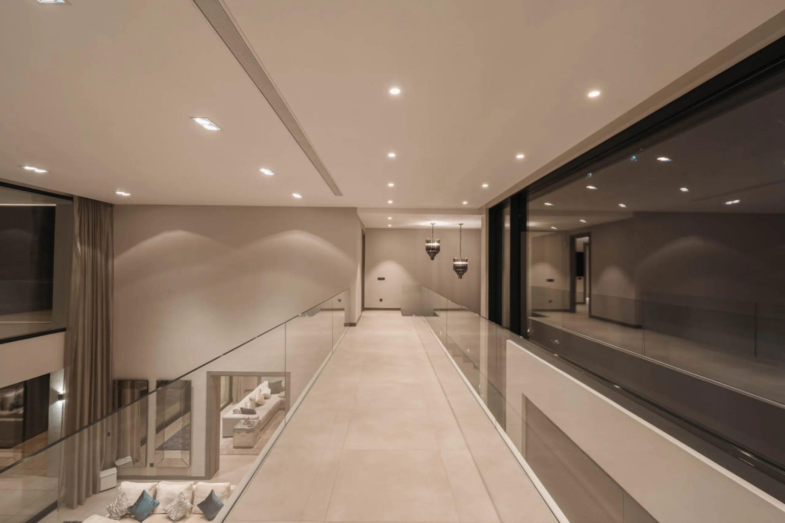Designed by a distinguished architect, this villa is spread over two levels with an impressive built area. It features five luxurious bedrooms, each with its ensuite bathroom, an additional guest toilet, and a guest apartment that matches the main villa's