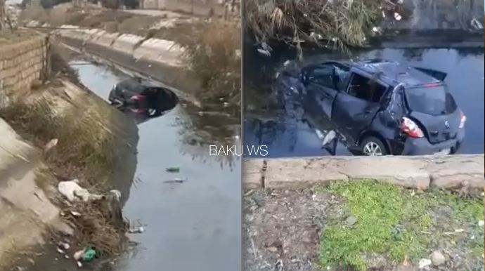 Qadın sürücü avtomobili kanala aşırdı: Yanında məktəbli övladı da olub - VİDEO