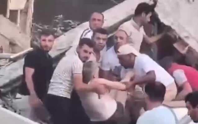 Sakinlərin dağıntılar altından çıxarılması anı - Video 