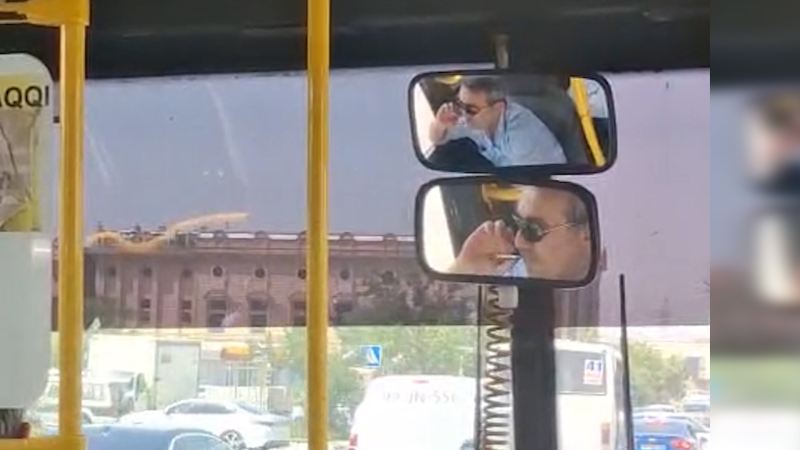 Marşrut sürücüsü sükan arxasında siqaret çəkdi - Mübahisə düşdü (VİDEO) 