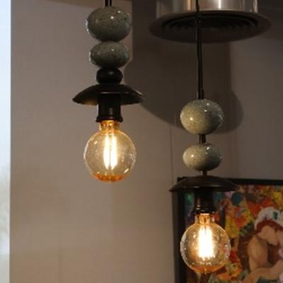 Black pendant with blue balls