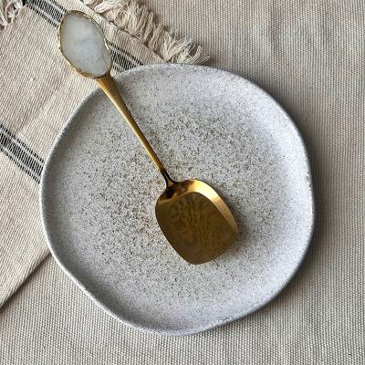 White/ gold buffet serving spoon