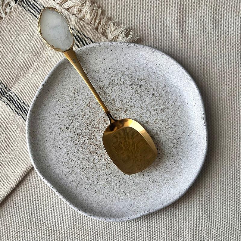 White/ gold buffet serving spoon