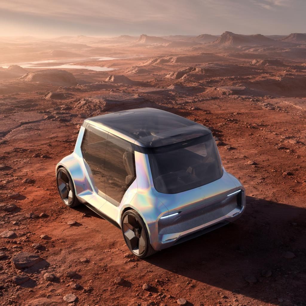Aerial view of a futuristic 2080 sports coupe in iridescent silver on an arid Mars-like landscape.