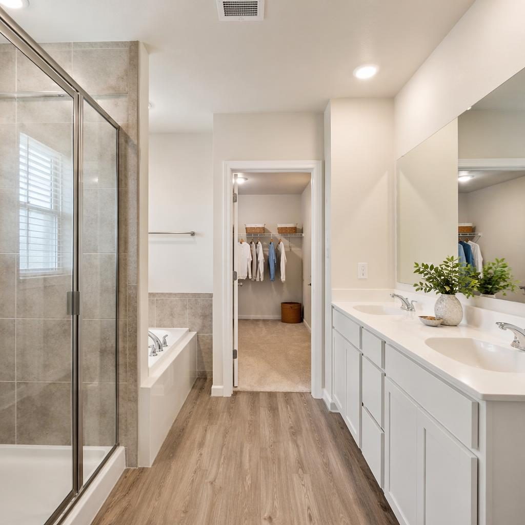 Bright beach house bathroom with wide-angle view, sharp staging, organized walk-in closet, and clutter-free realtor framing.