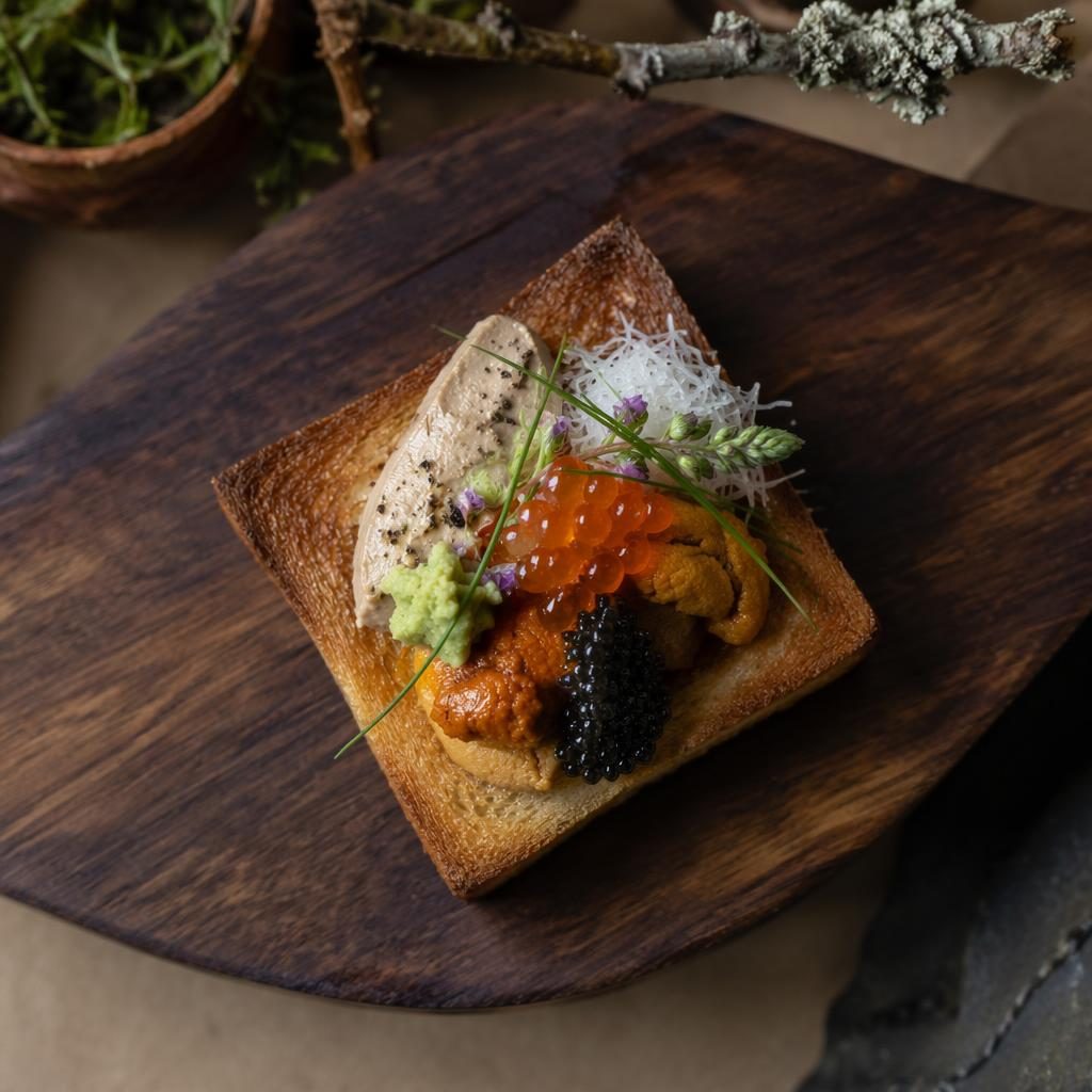 Top-down editorial photo of Japanese kaiseki toast plated on a wooden board in natural light with earthy rustic styling.