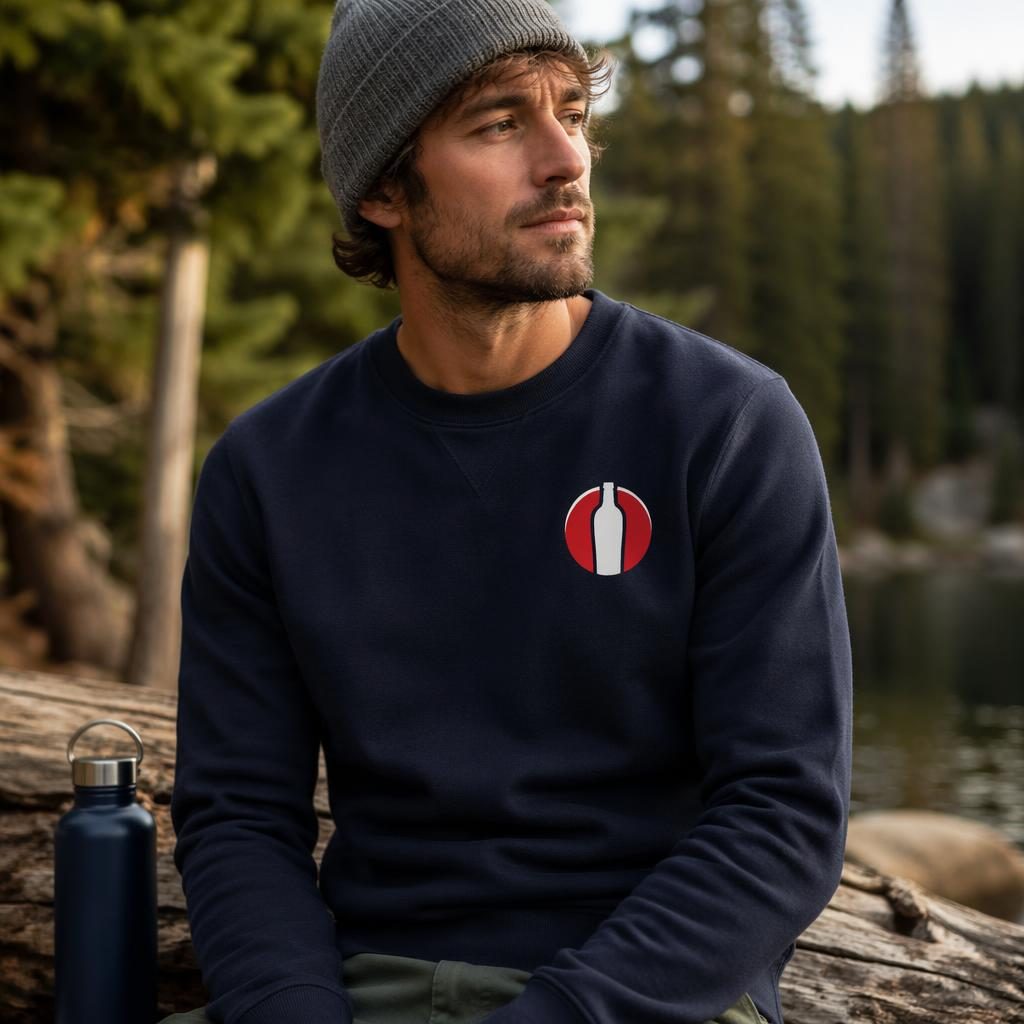 Photo-real navy sweatshirt mockup outdoors with a small printed steel water bottle logo on the left chest