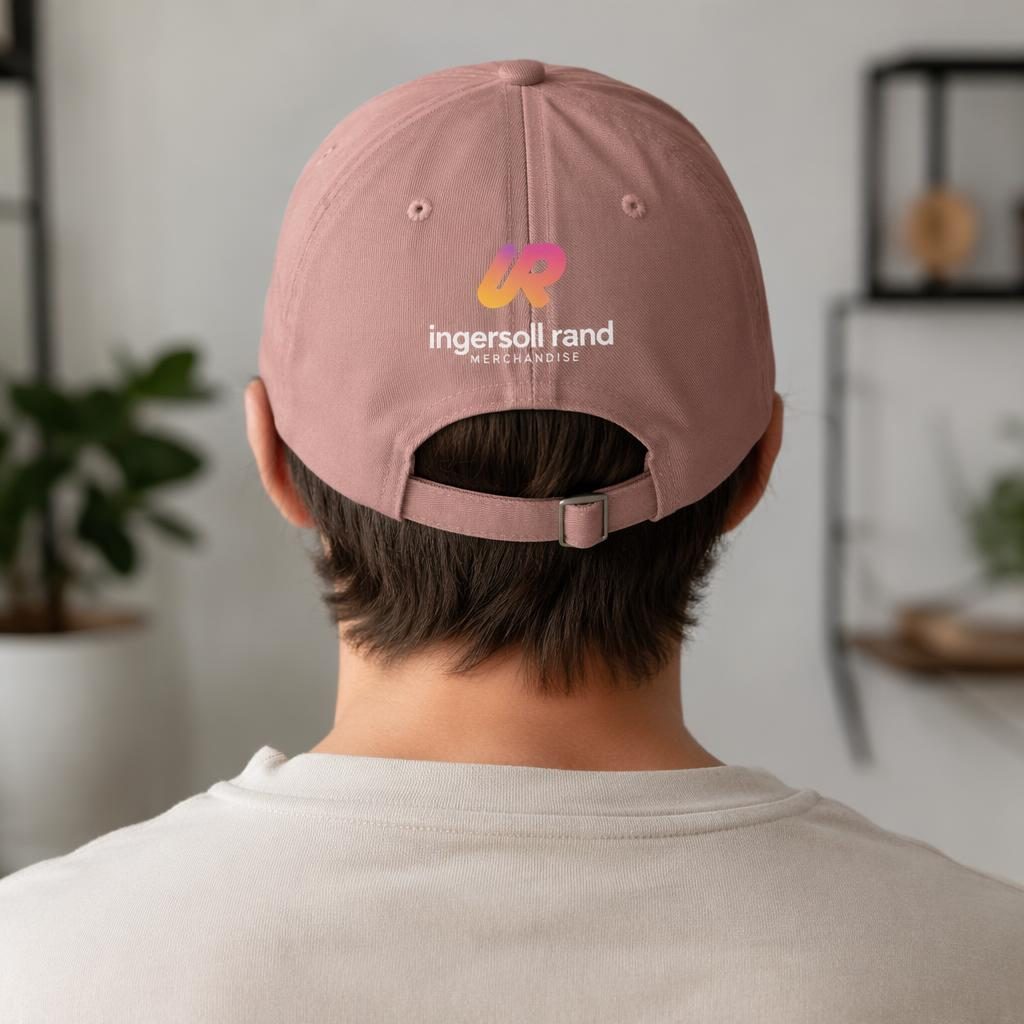 Model wearing a dusty pink cap with a vibrant gradient placeholder logo printed across the back in a studio mockup.