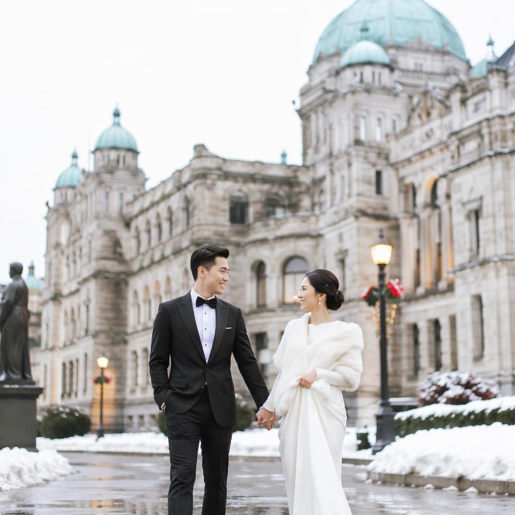 Couple walking hand in hand after a wedding ceremony in a snowy alpine backyard, candid natural-light portrait in blush and cream tones.