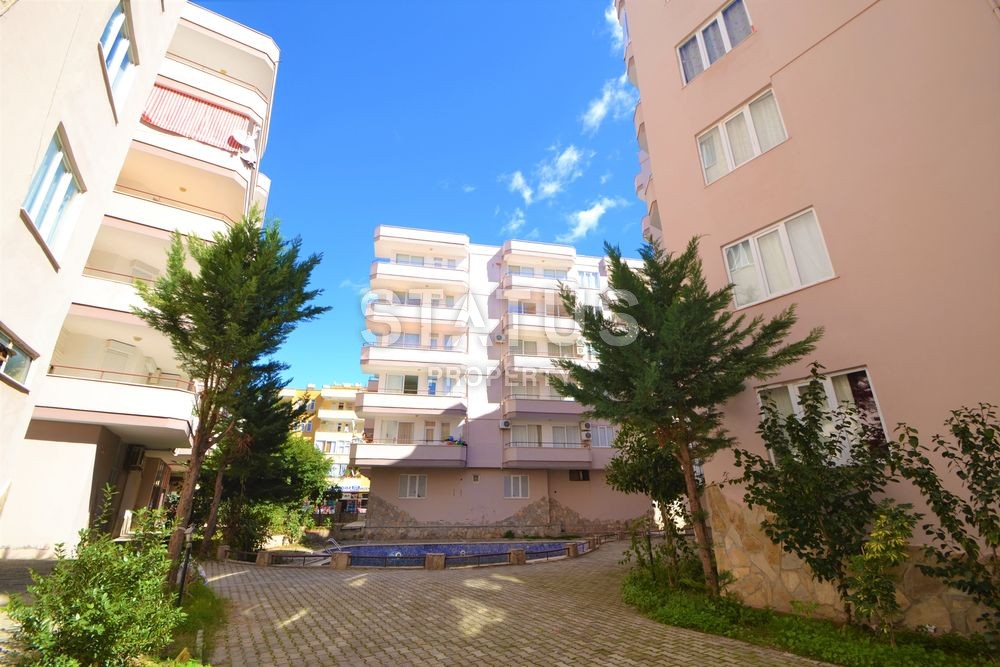 Inexpensive apartment in the center of Mahmutlar with inexpensive complex maintenance. фото 2