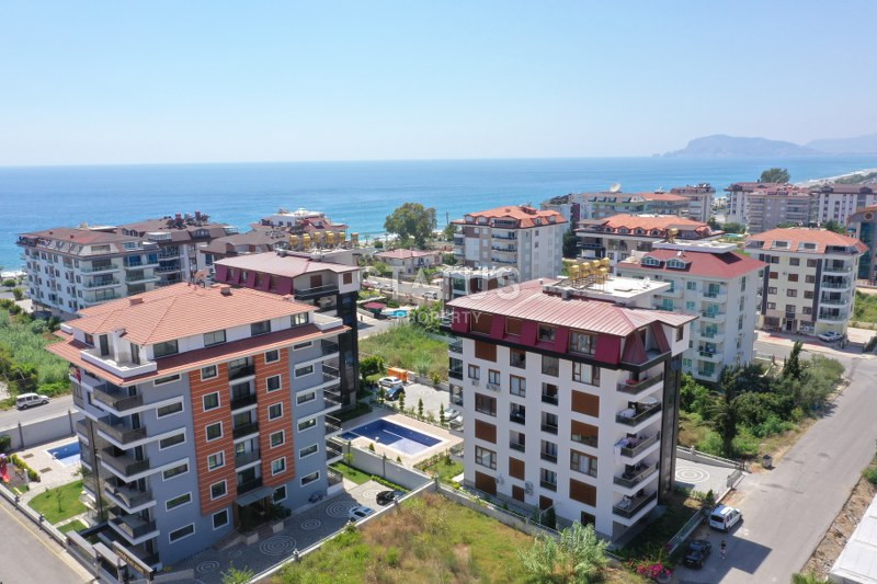 Furnished duplex 3+1 and apartments with sea view 2+1 in a luxury complex by the sea in Kestel. фото 1