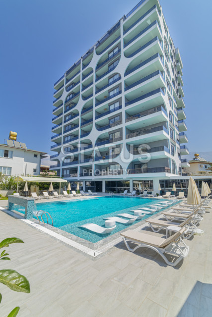 Квартира 1+1 в элитном новом комплексе, 60 м2 в Махмутларе. фото 1